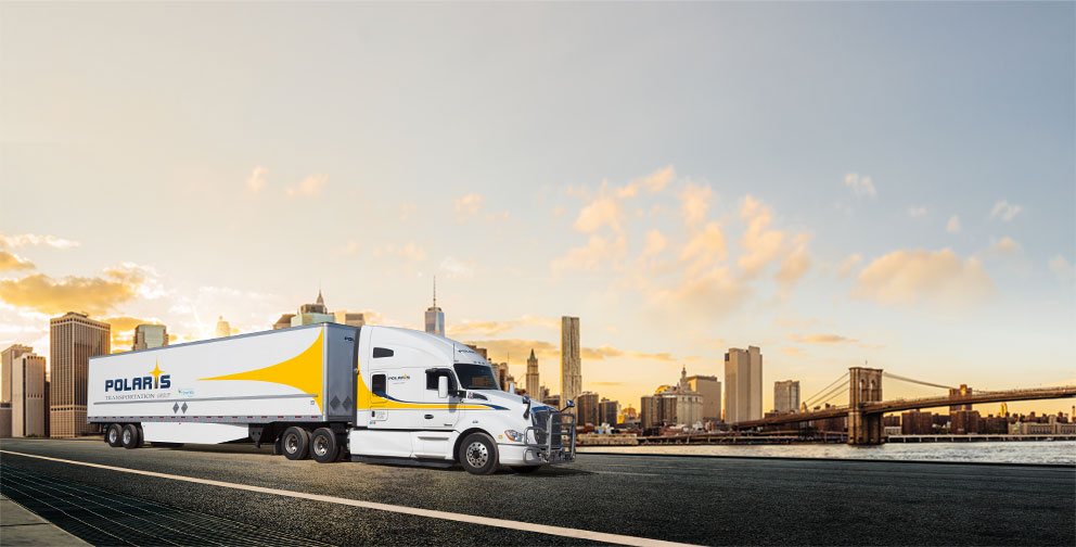 Polaris semi-trailer driving in front of cityscape 