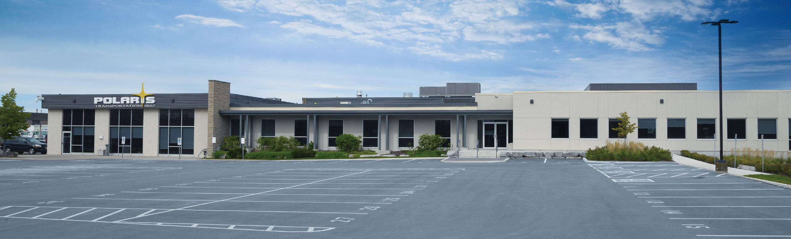 Exterior of Polaris headquarters with parking lot 