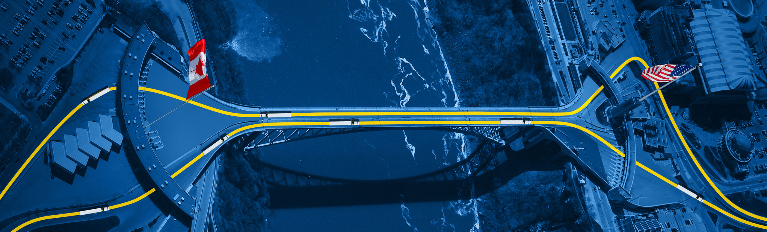 Overview perspective of Canada-U.S. bridge above river 
