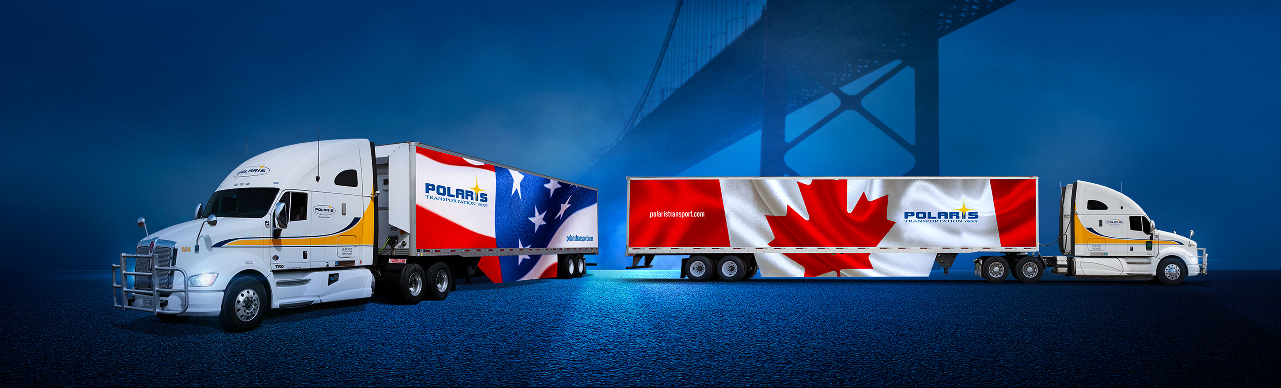 One Polaris truck with U.S. flag on trailer and another with Canada flag on trailer