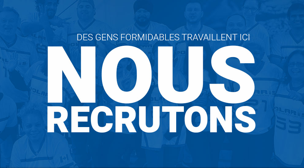 Groupe d'employés portant des chandails Polaris avec NOUS EMBAUCHONS au premier plan 