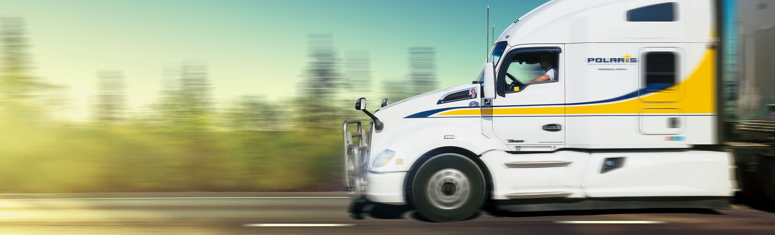 Side view of Polaris highway tractor in motion 