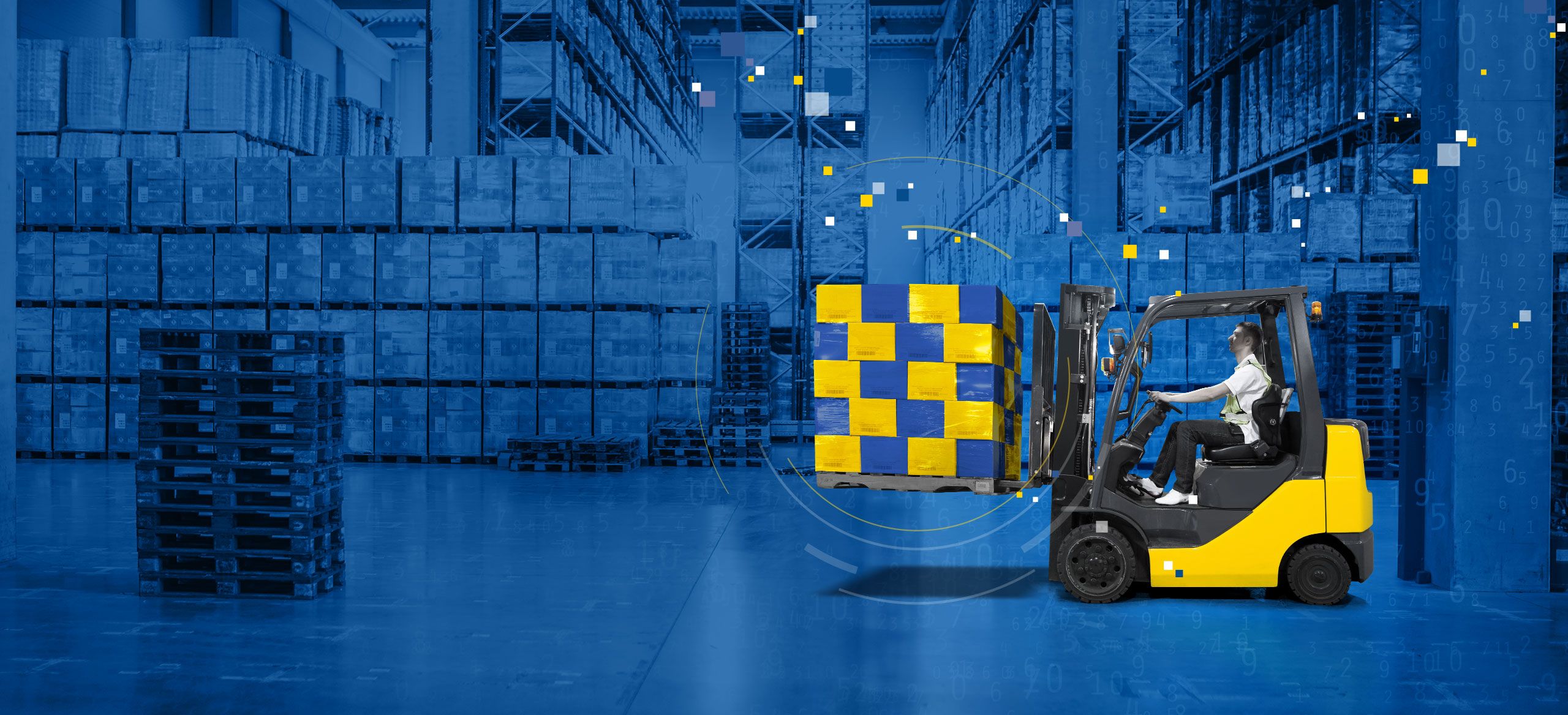 Warehouse interior with yellow forklift holding 20 blue and yellow boxes